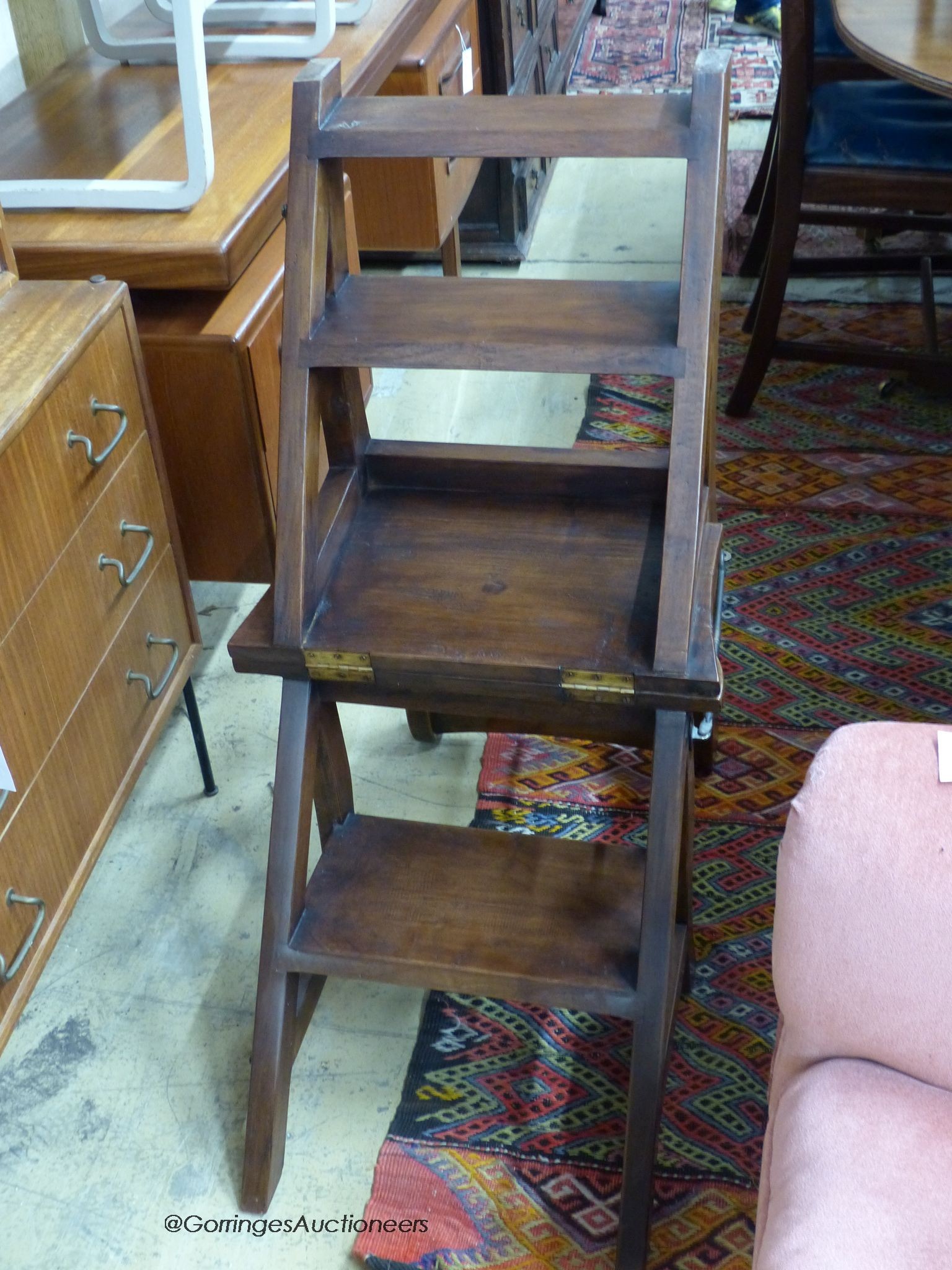 A reproduction mahogany metamorphic library chair